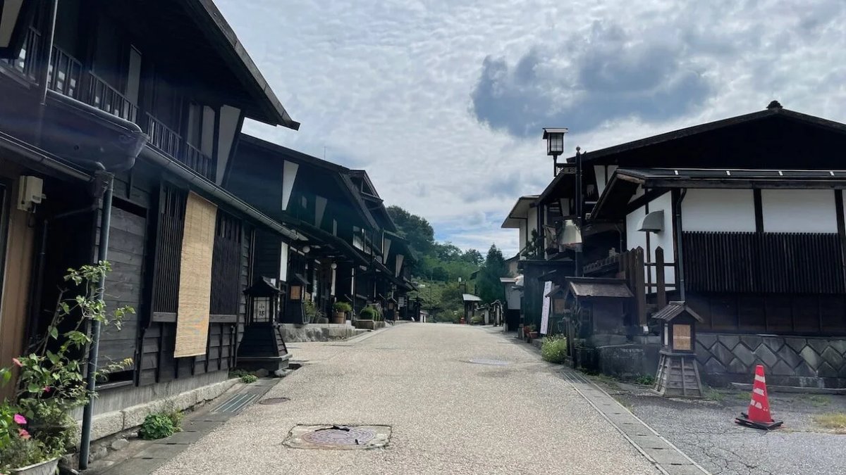 A quiet street lined with traditional wooden buildings in old Kiso-Fukushima