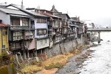 Traditional houses built on stilts above the river in Kiso-Fukushima's Gakeya-zukuri district