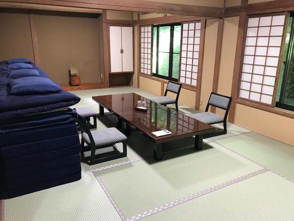 A tatami room set up with futon bedding for a family